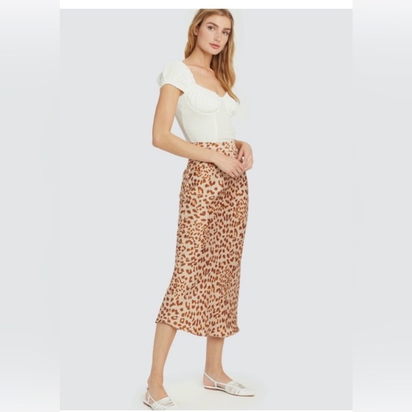 13. Free People Normani Bias
Leopard Print Satin Midi
Skirt
Size: 2 - Picture 2 of 6